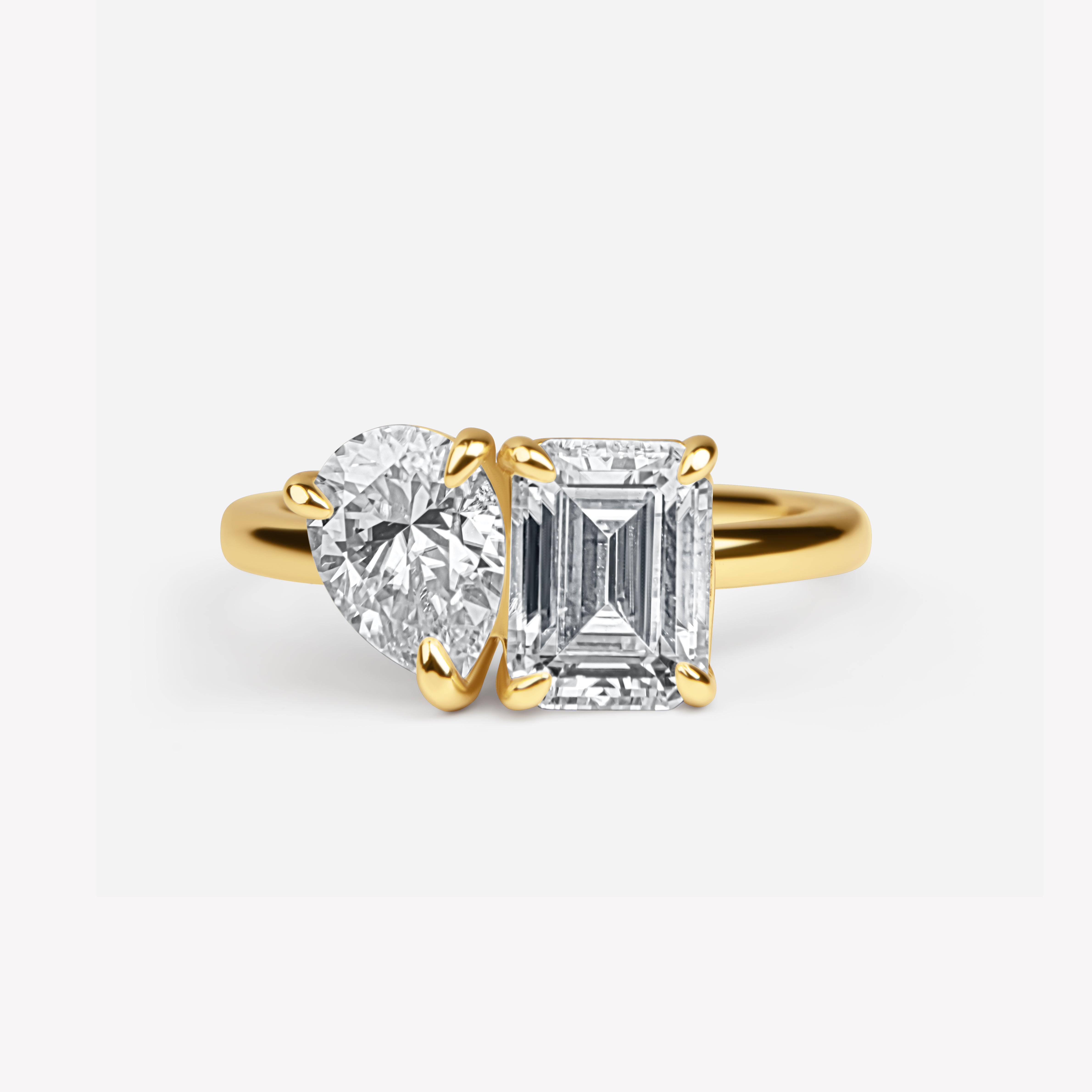 The Gemini Ring - 2Crt Emerald Cut & 1Crt Pear Cut Moissanite Diamond