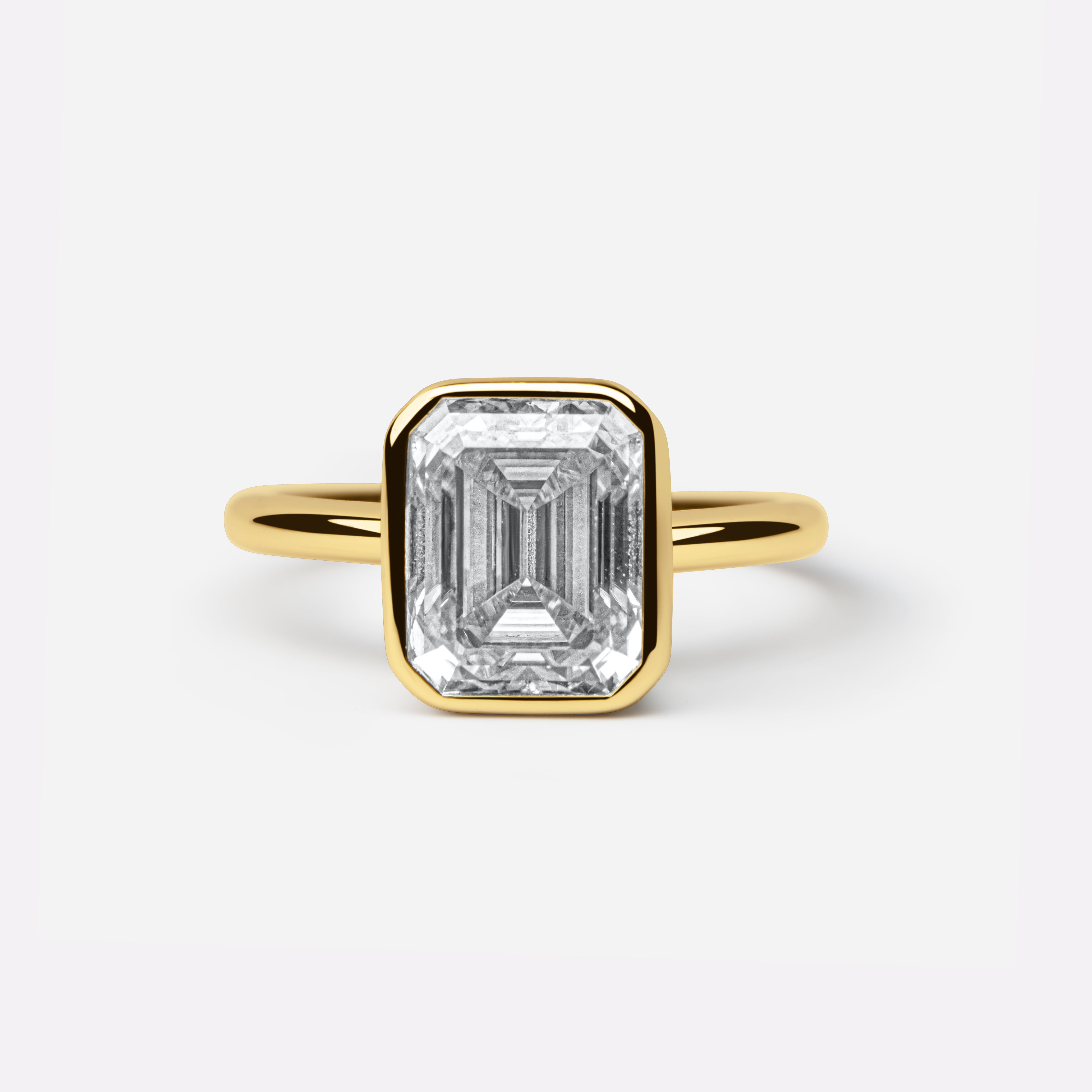 The Aurora Ring - 3Crt Emerald Bezel Ring